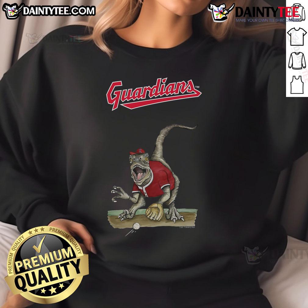 Awesome Cleveland Guardians Tiny Turnip Velociraptor Sweatshirt featuring a vibrant dinosaur design for fans.