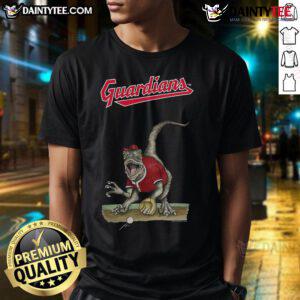 Alt Text: Awesome Cleveland Guardians Tiny Turnip Velociraptor T-Shirt featuring a playful dinosaur design for fans.