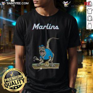 Alt Text: Awesome Miami Marlins Tiny Turnip Velociraptor T-Shirt featuring a fun dinosaur design for fans.