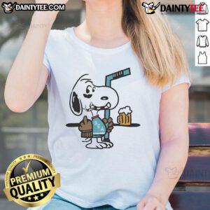 Alt Text: Cute Snoopy player in Seattle Kraken hockey gear, playfully showing middle finger on ladies tee shirt design.