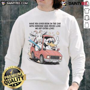 Funny goat and duck in a car wearing Extra Life sweatshirt, capturing the humor of wild rides and quirky companions.