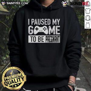 Funny 'I Paused My Game To Be Pregnant' hoodie design showcasing gaming humor and pregnancy theme in vibrant colors.