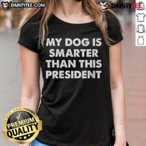 Funny ladies tee featuring 'My Dog Is Smarter Than The President' slogan, perfect for dog lovers and humor enthusiasts.