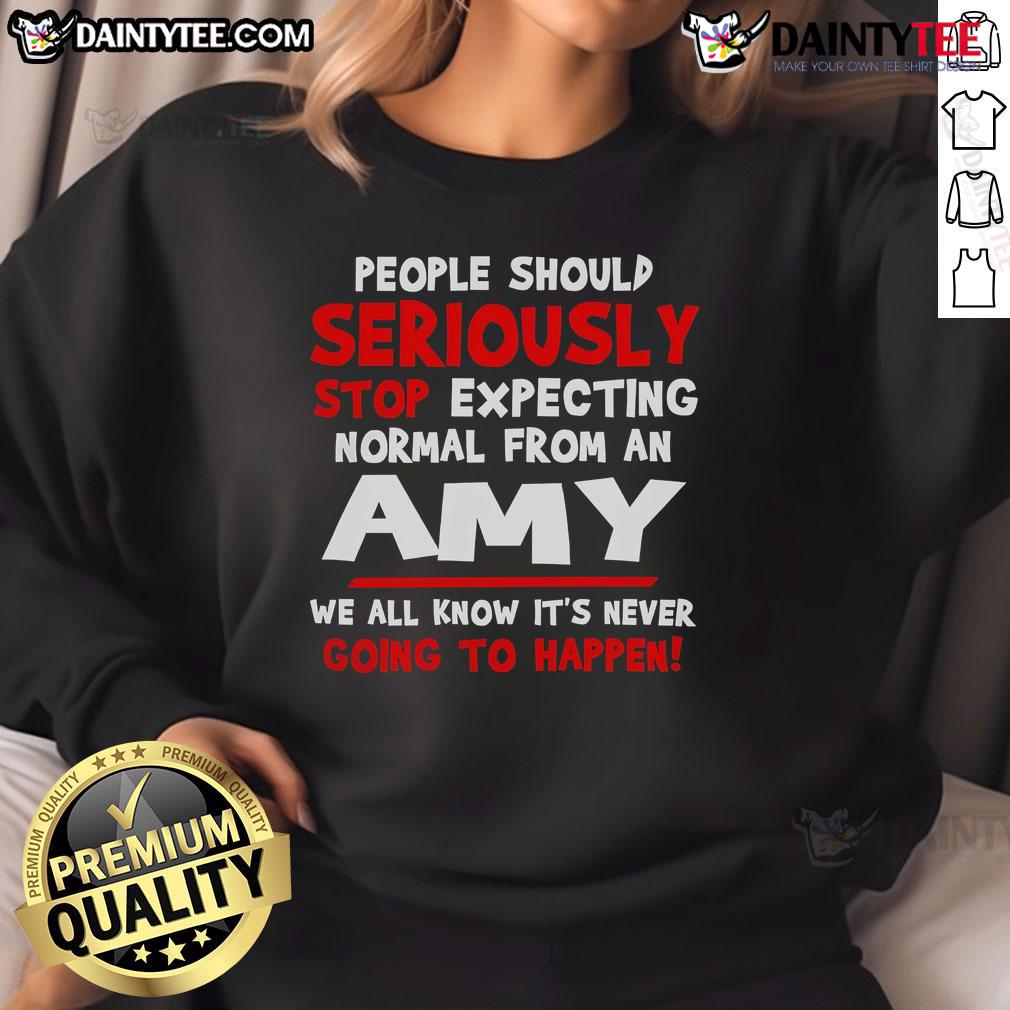 Funny people wearing 'Seriously Stop Expecting Normal' Amy sweatshirt, showcasing humor and unique fashion style.