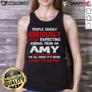 Funny people wearing 'Should Seriously Stop Expecting Normal' Amy tank top, showcasing humor and personality in style.