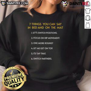 Cozy 'Funny Things You Can Say In Bed And On The Mat' sweatshirt featuring playful text design, perfect for humor lovers.