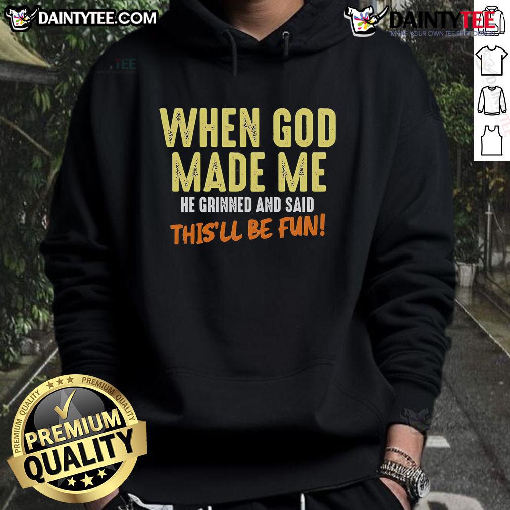 Funny hoodie with the quote 'When God Made Me, He Grinned and Said This'll Be Fun' in playful lettering.