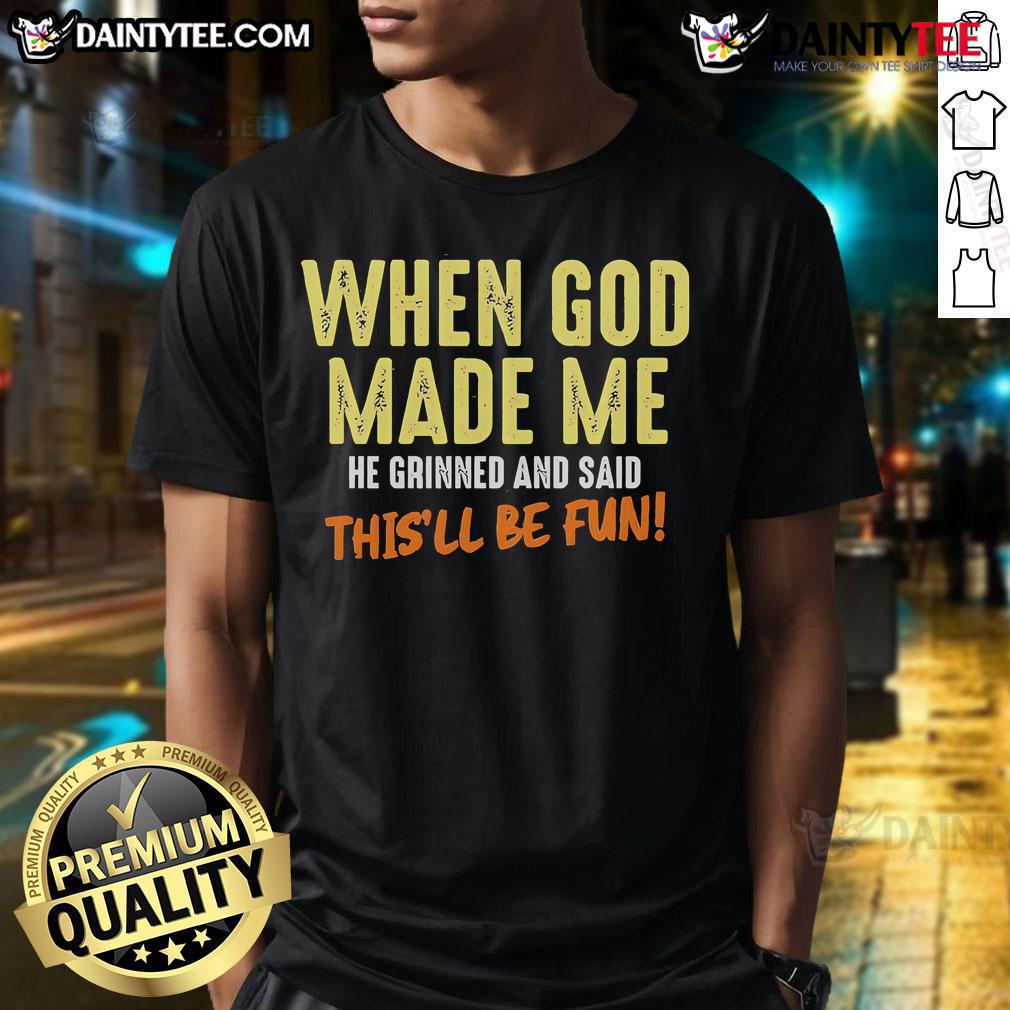 Funny T-shirt with 'When God Made Me He Grinned And Said This'll Be Fun' text, perfect for humor lovers and unique gifts.