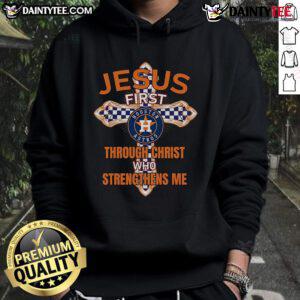 Happy Houston Astros fan wearing a 'Jesus First Through Christ Who Strengthens Me' hoodie at a game.