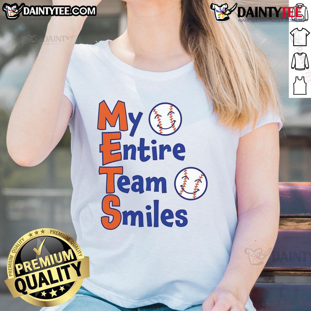 Happy Mets team smiles together in baseball ladies tee, showcasing team spirit and camaraderie on the field.