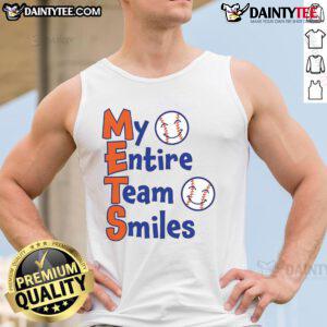 Alt Text: Happy Mets team smiles in baseball tank tops, showcasing team spirit and camaraderie on the field.