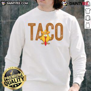 Funny sweatshirt featuring 'Hot Taco Trump Always Chickens Out' graphic, perfect for humor and political satire lovers.