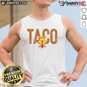 Funny tank top featuring a cartoon of Trump with a taco, captioned Hot Taco Trump Always Chickens Out. Perfect for humor!