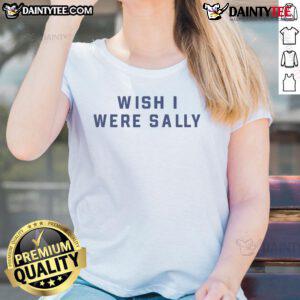 Conan Gray wearing 'Wish I Were Sally' ladies tee, showcasing a stylish and casual look in a vibrant setting.