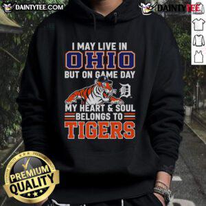 Person wearing a Detroit Tigers hoodie, showcasing team spirit in Ohio on game day, with vibrant colors and logo visible.
