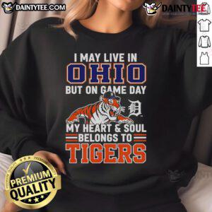Cozy sweatshirt reads 'I May Live In Ohio But On Game Day My Heart Belongs To The Detroit Tigers' in bold lettering.