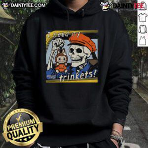 Alt Text: Awesome skeleton holding a Labubu plush, wearing an I Need My Trinkets hoodie, perfect for quirky fashion lovers.