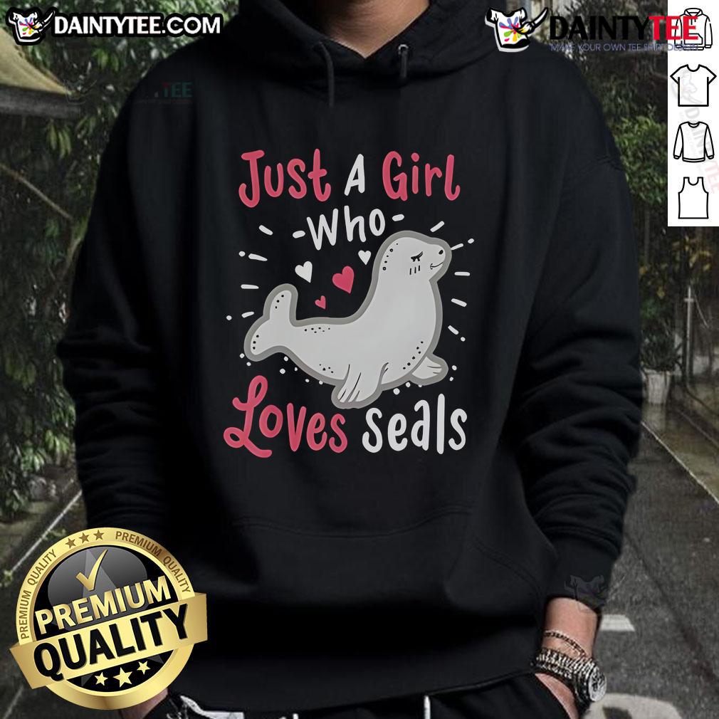 Cute girl wearing a 'Just A Girl Who Loves Seals' hoodie, smiling with a seal plush toy, showcasing her love for seals.