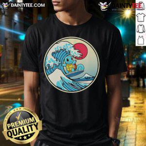 Alt Text: Cute Pokmon Squirtle surfing a vibrant water wave on a stylish t-shirt, perfect for Pokmon fans and beach lovers.