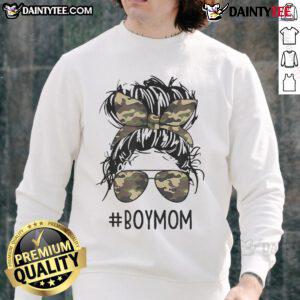 Funny mom in a messy bun wearing a sweatshirt, embodying mom life with her boys, showcasing motherhood humor.