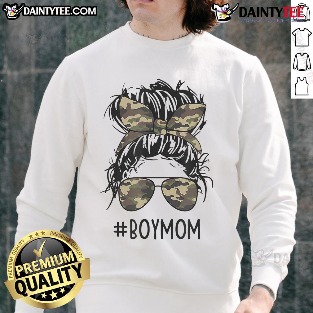 Funny mom in a messy bun wearing a sweatshirt, embodying mom life with her boys, showcasing motherhood humor.