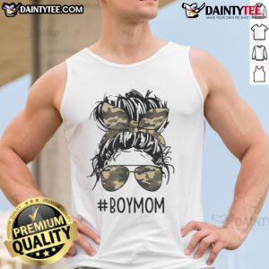 Mom of boys in a tank top with a funny quote, showcasing messy bun hairstyle and playful mom life vibe.