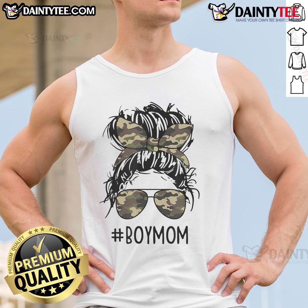 Mom of boys in a tank top with a funny quote, showcasing messy bun hairstyle and playful mom life vibe.