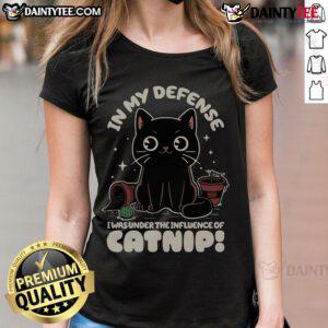 Alt Text: Funny cat in a humorous tee saying 'In My Defense, I Was Under The Influence Of Catnip' - perfect for cat lovers.