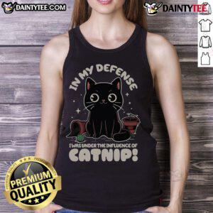 Funny cat in a tank top with In My Defense, I Was Under The Influence of Catnip design, showcasing a playful feline moment.
