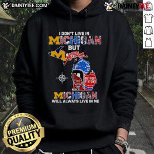 Cozy hoodie featuring 'I Don't Live in Michigan But Michigan Will Always Live in Me' design, perfect for Michigan fans.