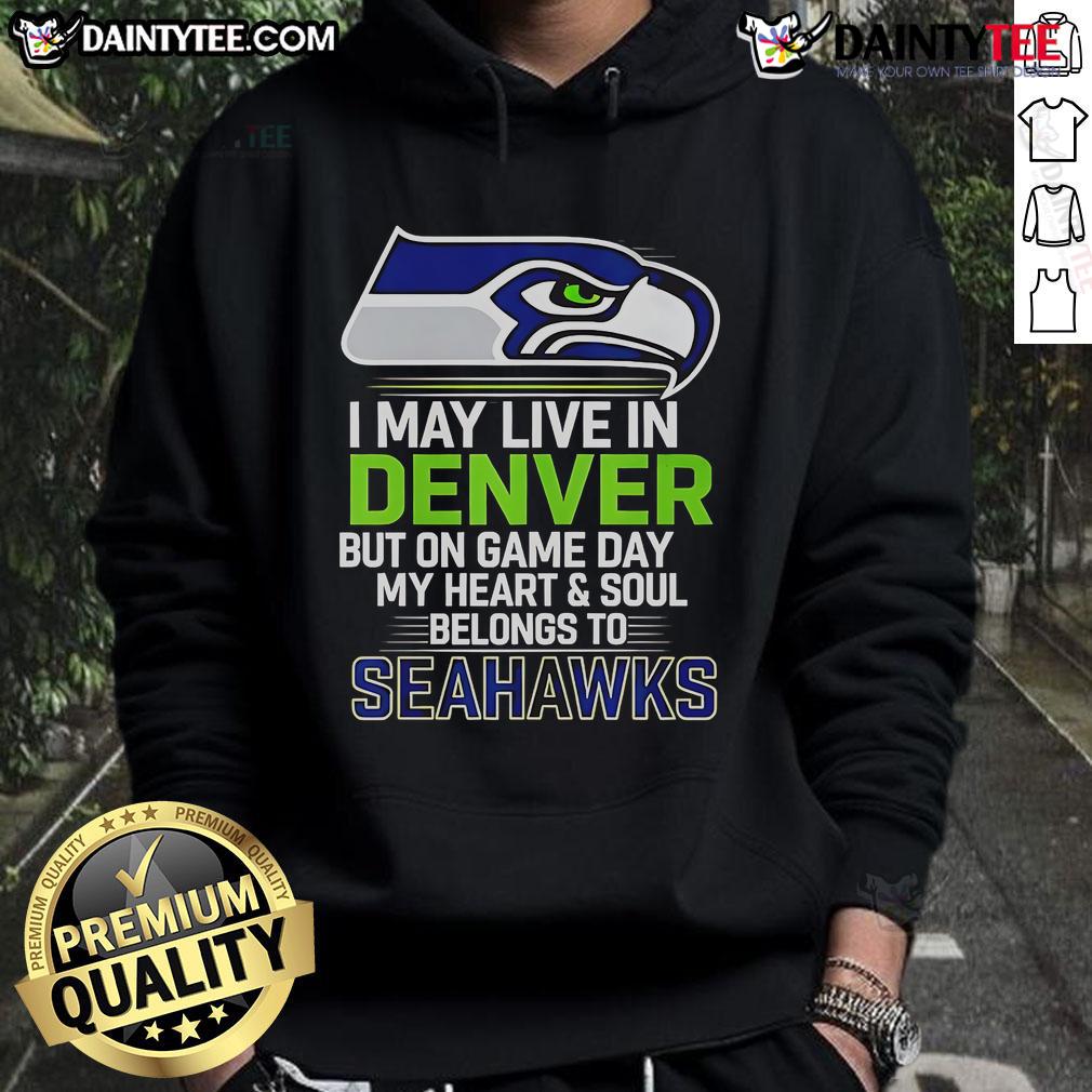 Man wearing Seattle Seahawks hoodie, showcasing pride on game day, despite living in Denver.