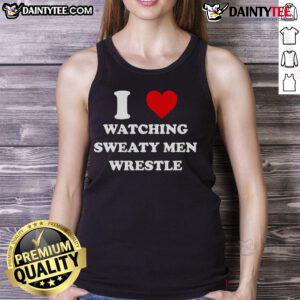 Alt Text: Awesome scene of sweaty men wrestling in tank tops, showcasing strength and athleticism during a competitive match.