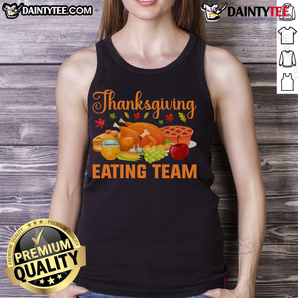 Awesome Thanksgiving eating team wearing turkey day feast tank tops, celebrating food lovers' joy during the holiday.