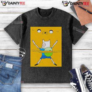 Cute Finn the Human hugging a plush toy, wearing a washed t-shirt featuring Adventure Time characters.