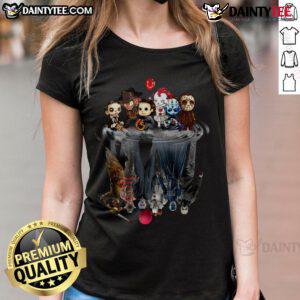 Alt Text: Cute horror movie villains baby reflection on Halloween ladies tee, showcasing playful spooky designs for Halloween fashion.