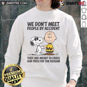 Adorable Snoopy sweatshirt with 'We Don't Meet People By Accident' quote, perfect for Peanuts fans and cozy style.