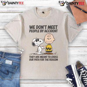 Cute Peanuts Snoopy t-shirt with We don't meet people by accident quote, perfect for fans of Peanuts and whimsical fashion.