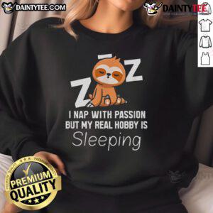 Alt Text: Cozy sweatshirt featuring a cute sloth with the phrase I nap with passion, but my real hobby is sleeping.