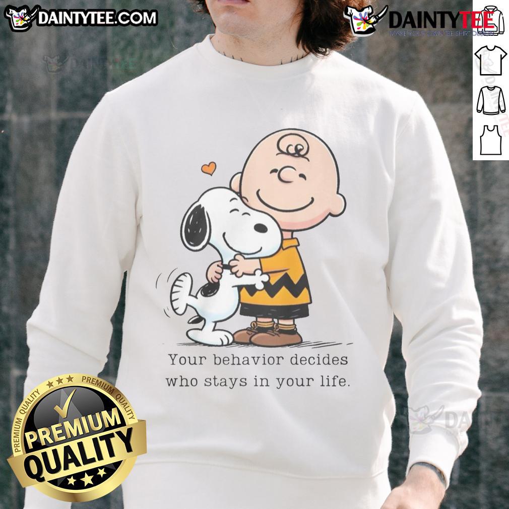 Alt Text: Cute Snoopy Peanuts sweatshirt with the quote 'Your behavior decides who stays in your life' in colorful design.