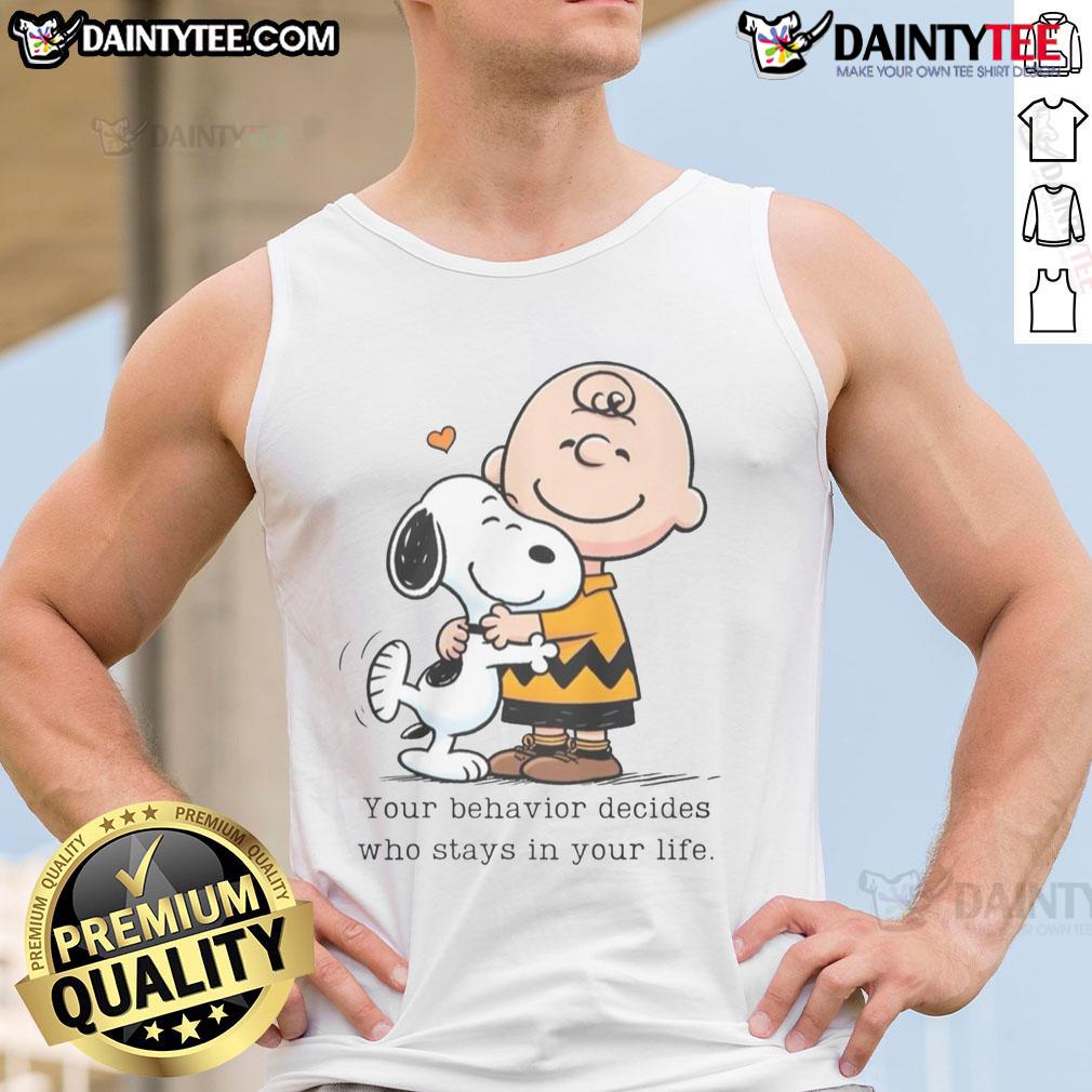 Cute Snoopy Peanuts tank top featuring the quote 'Your Behavior Decides Who Stays In Your Life' in vibrant colors.