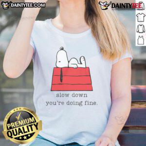 Alt Text: Cute Snoopy Slow Down, You're Doing Fine ladies tee featuring a colorful graphic design perfect for casual wear.