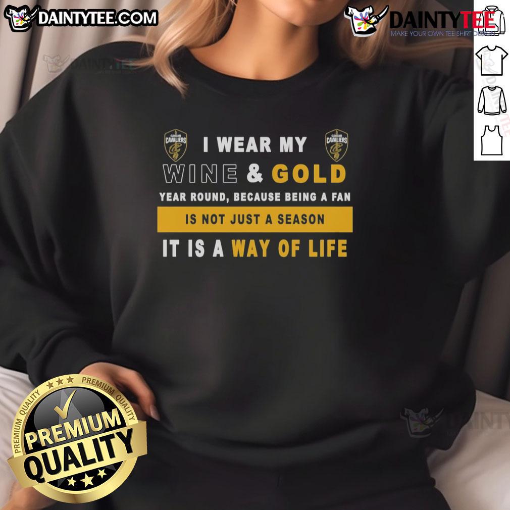 Alt Text: Cleveland Cavaliers sweatshirt with 'I Wear My Wine And Gold Year Round' slogan, perfect for dedicated fans.