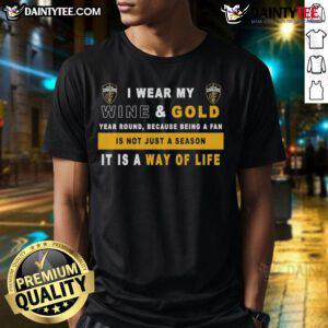 Alt Text: Cleveland Cavaliers fan wearing a wine and gold t-shirt that says 'I Wear My Wine And Gold Year Round' showcasing team pride.