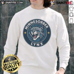 Alt Text: Good Minnesobber Lynx logo parody sweatshirt featuring a playful design and vibrant colors, perfect for sports fans.