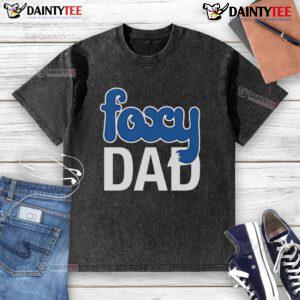 Nick Wilde wearing a 'Foxy Dad' washed t-shirt, showcasing a playful and stylish look in a vibrant setting.