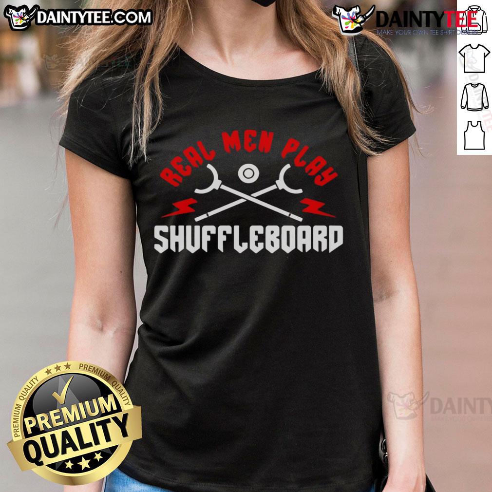 Good real men play shuffleboard in stylish ladies' tees, showcasing fun and camaraderie at the game.