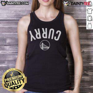 Steph Curry wearing an inverted Golden State Warriors tank top, showcasing his iconic style and team spirit.
