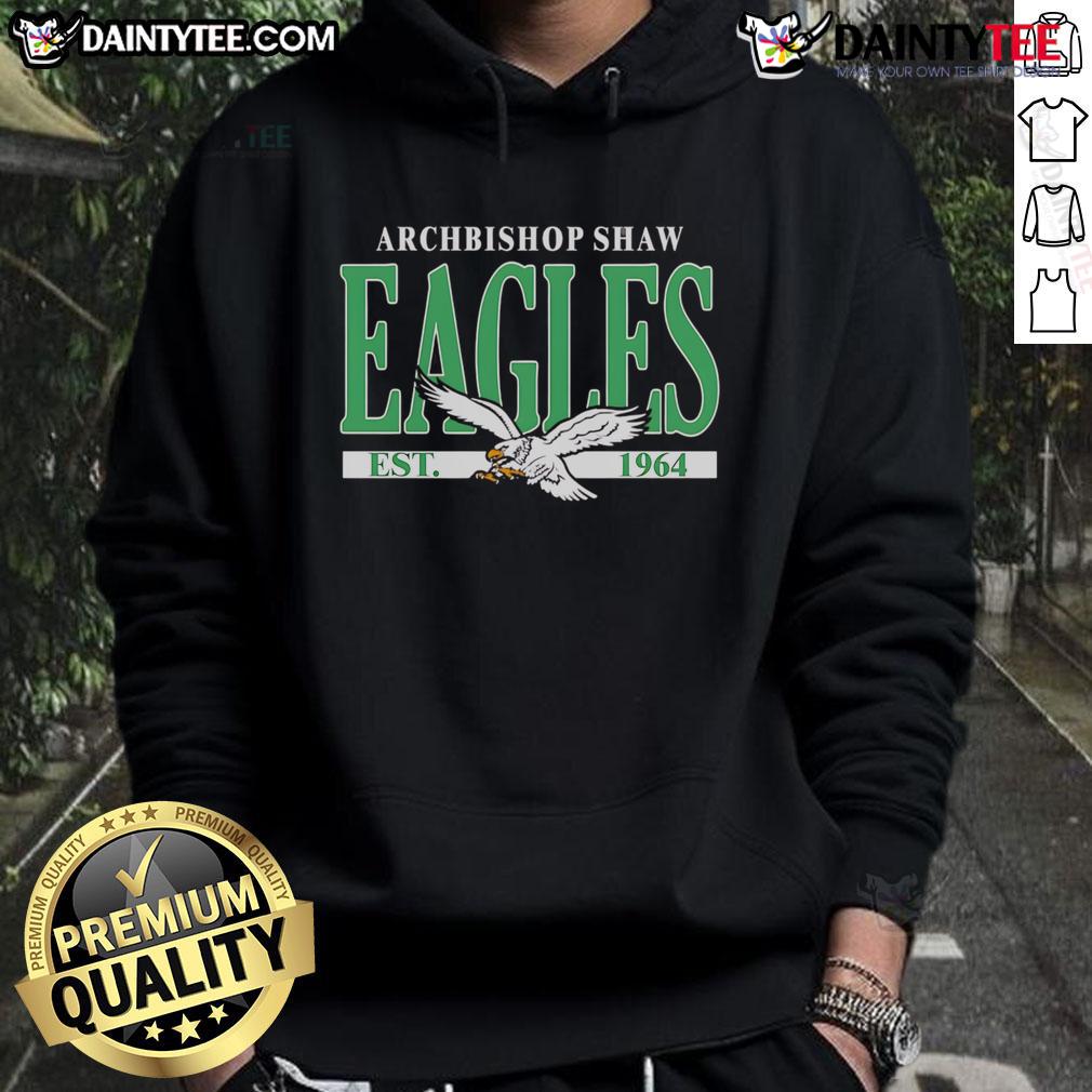 Happy fan wearing a Philadelphia Eagles hoodie celebrating Archbishop Shaw Eagles, established 1964, showcasing team spirit.