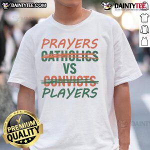 Nice Prayers Vs Players T-Shirt features a bold design contrasting faith and sports, perfect for Catholics and fans alike.