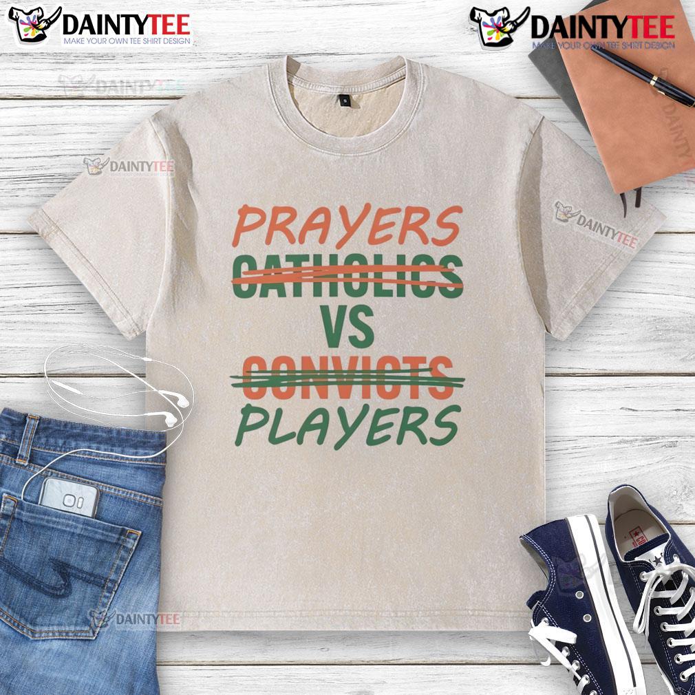 Nice Prayers vs Players Not Catholics vs Convicts washed T-shirt design featuring bold text and vibrant colors.